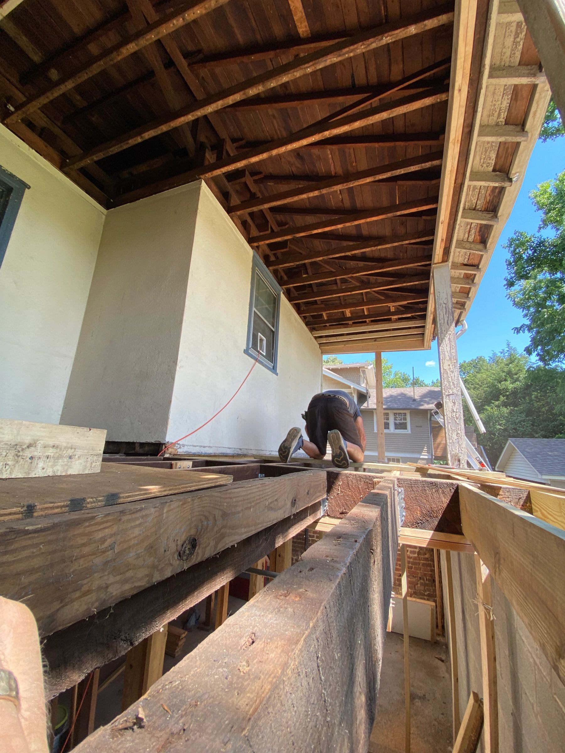 Planing porch joists to ensure proper pitch to shed water