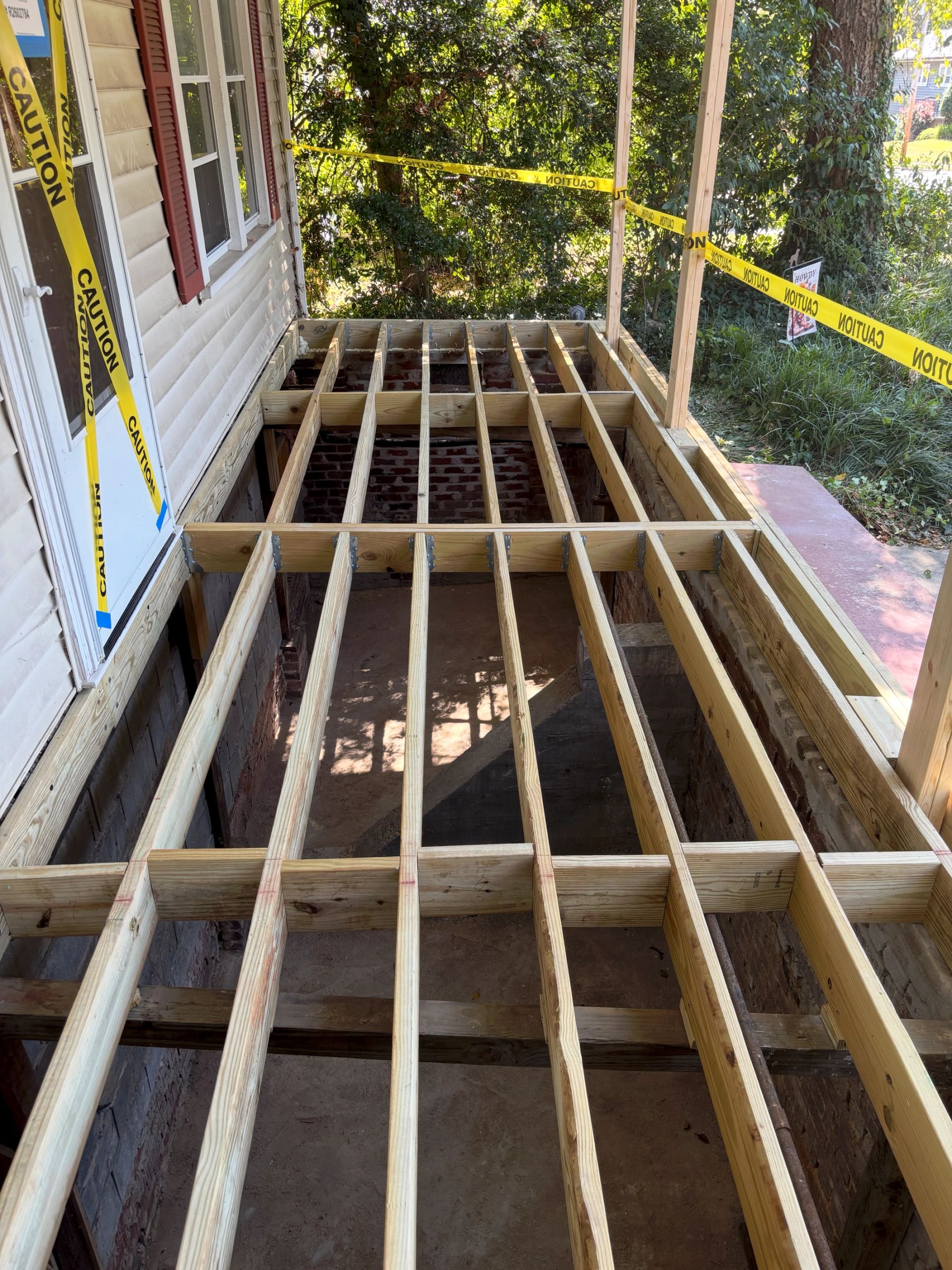 Newly constructed framing for front porch on old home