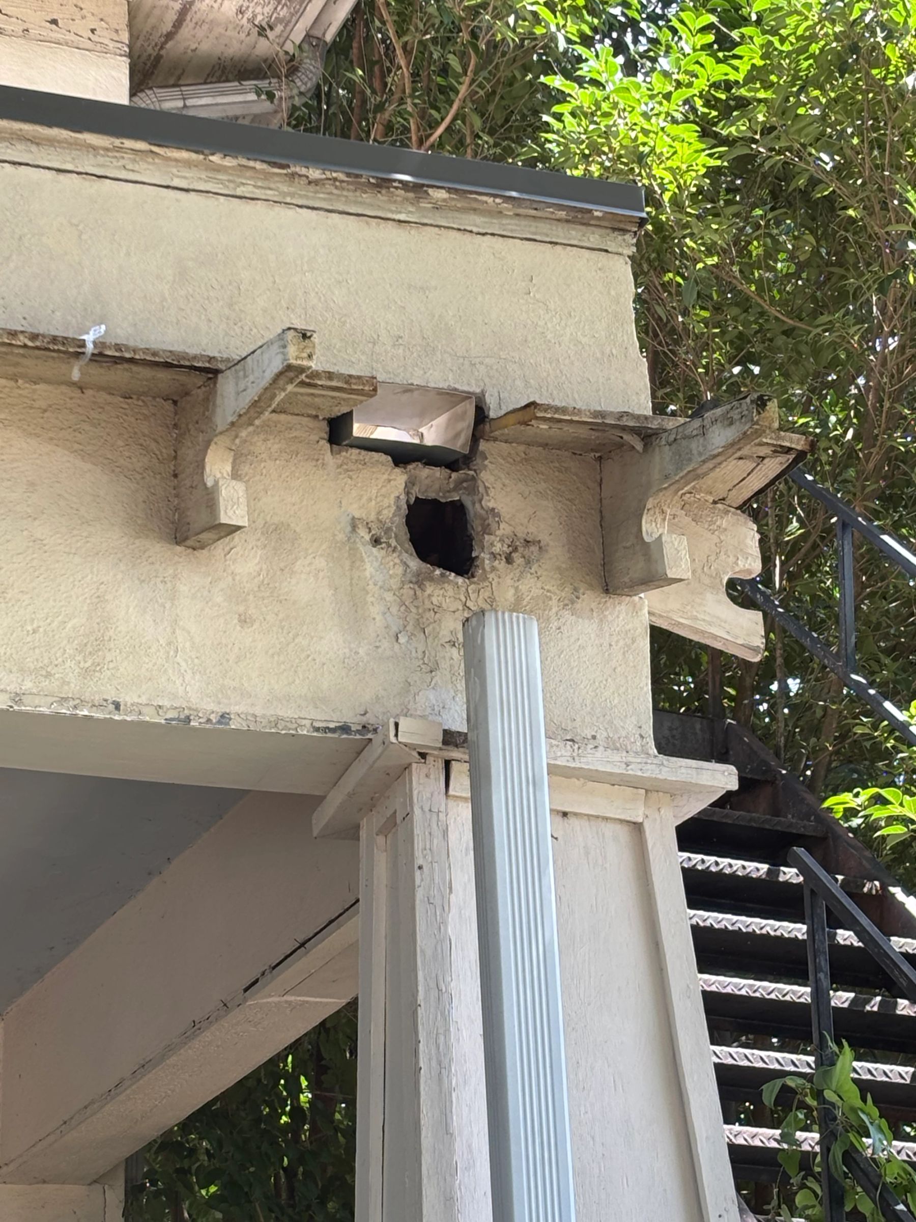 Replacing the roof required relocating and replacing the faulty gutter downspouts